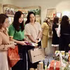 Visitors explore products showcased through social media platforms. (Photo: VNA)