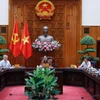 Prime Minister Pham Minh Chinh chairs the meeting of the steering committee on building regional and international financial centres. (Photo: VNA)