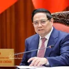 Prime Minister Pham Minh Chinh speaks at the meeting (Photo: VNA)