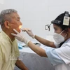 An elderly receives health check-ups. (Photo: VNA)