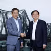 Deputy Prime Minister Ho Quoc Dung (R) and CEO of Switzerland-based FS Finance Suisse AG Roland Staub (Photo: VGP)