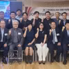 Participants pose for a group photo at the roundtable held by the Vietnamese Consulate General in Busan (Photo: VNA)