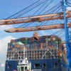 Containers are loaded onto a vessel at Gemalink International Port in Ho Chi Minh City. (Photo: VNA)