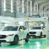 Inside the passenger car assembly factory of THACO in the Chu Lai Open Economic Zone in Da Nang city (Photo: VNA)