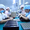 Workers assembles electronic components on the production line at the Bao Sen Co., Ltd. in Bac Ninh province. (Photo: VNA)