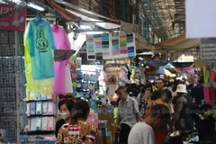Shoppers stroll around Bangkok’s Sampheng Market as consumer spending remains pressured by high household debt. (Photo: Bangkok Post)