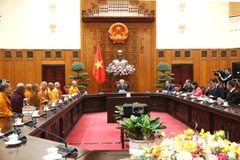 Permanent Deputy Prime Minister Nguyen Hoa Binh hosts a meeting with the International Council for the Day of Vesak on February 27. (Photo: VNA)