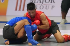Tran Ngoc Luong (right) is one of Vietnamese athletes in the Asian Mixed Martial Arts Championships 2026 in China. (Photo: VNA)