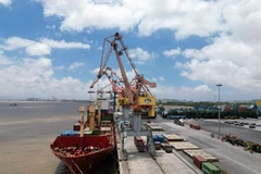 A vessel docks at Hai Phong Port ready to be loaded with containers. (Photo: VNA/VNS)