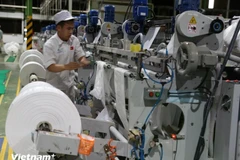 Businesses accelerate their adoption of technology to enhance labour productivity. (Photo: VietnamPlus)