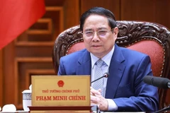 Prime Minister Pham Minh Chinh chairs a meeting on June 28 to continue reviewing and resolving US concerns regarding trade and tariffs. (Photo: VNA)