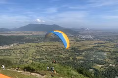 A paraglider takes off on Phung Hoang Mountain in An Giang province’s Tri Ton district. (Photo: VNA)