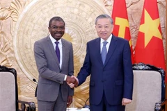 Party General Secretary To Lam (R) hosts a reception for Lazare Eloundou Assomo, Director of the UNESCO World Heritage Centre. (Photo: VNA)