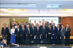 Party General Secretary To Lam pose for a commemorative photo with the delegates. (Photo: VNA)