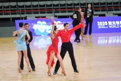 Vietnamese Pham Trung Hoa - Nguyen My Trang (in red) dance for their gold medal in the World Master Games's event on May 28 in Chinese Taipei. 