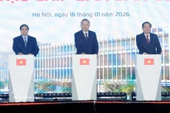 Party General Secretary To Lam (centre), Prime Minister Pham Minh Chinh (left), and Chairman of the Party Central Committee’s Commission for Internal Affairs Phan Dinh Trac mark the start of work on a high-tech semiconductor manufacturing plant in Hanoi on January 16, 2026. (Photo: VNA) 