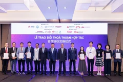 At the signing ceremony between parties (Photo published by VNA)