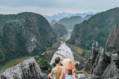 Foreign tourists at the peak of Mua cave in Ninh Binh province. (Photo published by VNA)