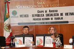 The signing ceremony of the Vietnam–Mexico parliamentary cooperation. agenda. (Photo: VNA)