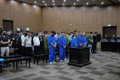 The defendants listen to the court’s verdict. (Photo: VNA)