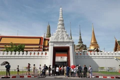 Tourists wait outside a gate at the Grand Palace in Bangkok in June 2025. (Photo: Bangkok Post)