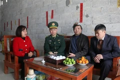 Nong Van Cam in his newly built house in Hop Nhat hamlet, Ly Quoc commune, Ha Lang district, Cao Bang province. (Photo: VNA)