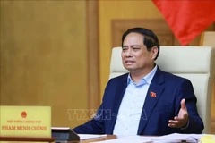 Prime Minister Pham Minh Chinh chairs a meeting with ministry and sector leaders on preparations for the exhibition, to be held in celebration of the 80th anniversary of the National Day (September 2, 1945 –2025). (Photo: VNA)