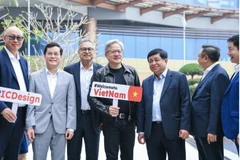 Minister of Planning and Investment Nguyen Chi Dung (third, right) and Jensen Huang, Chairman and CEO of NVIDIA, the world’s leading technology and chip manufacturer, during the latter’s visit to Vietnam in December 2023. (Photo: VNA)