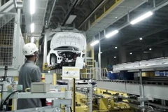 A worker installs the battery of a Hyundai IONIQ 5 electric car on April 6, 2023, at the Hyundai Motor Manufacturing Indonesia (HMMI) assembly plant in Cikarang, West Java. (Photo: Jakarta Post) 