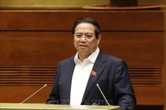 Prime Minister Pham Minh Chinh delivers a speech at the national conference to disseminate and implement the Politburo's Resolutions No. 66-NQ/TW and No. 68-NQ/TW. (Photo: VNA)