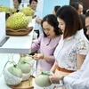 Fruit products displayed at the exhibition are equipped with QR codes for origin traceability. (Photo: VNA) 