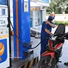 A commuter purchases fuel at a Petrolimex station. (Photo: VNA) 