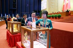 Delegates cast ballots to elect the 14th-term Party Central Committee. Photo: VNA