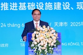 Prime Minister Pham Minh Chinh delivers remarks at the Vietnam – China Business Forum on June 24. (Photo: VNA)