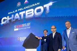 Minister of Communications Fahmi Fadzil launches the Sebenarnya.my Chatbot, known as AIFA, aimed to combat fake news and enable users to check the authenticity of unverified news online. (Photo: AWANI)