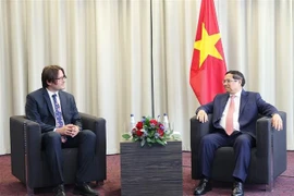 PM Pham Minh Chinh (R) receives President of Bolt Group Jevgeni Kabanov. (Photo: VNA)