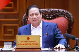 PM chairs a meeting to draft resolutions on breakthroughs in health care, education. (Photo: VNA)