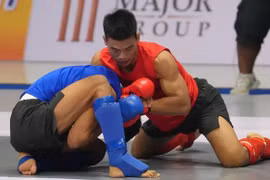Tran Ngoc Luong (right) is one of Vietnamese athletes in the Asian Mixed Martial Arts Championships 2026 in China. (Photo: VNA)