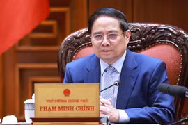 Prime Minister Pham Minh Chinh chairs a meeting on June 28 to continue reviewing and resolving US concerns regarding trade and tariffs. (Photo: VNA)
