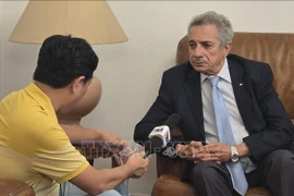 Mourad Lamoudi, FLN Central Committee member in charge of foreign affairs, grants an interview to the VNA. (Photo: VNA)
