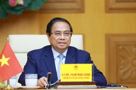 Prime Minister Pham Minh Chinh attends the virtual summit on climate action. (Photo: VNA)
