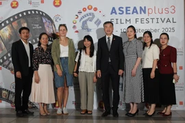 Vietnamese Ambassador to the Czech Republic Duong Hoai Nam poses for a commemorative photo with embassy staff at the opening ceremony. (Photo: VNA)