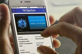 With the Vietnam News Daily mobile app, readers can access Vietnam News anytime, anywhere. (Photo published by VNA)