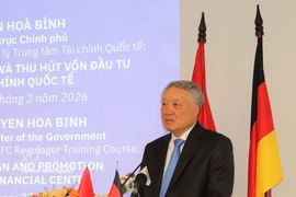 Permanent Deputy Prime Minister Nguyen Hoa Binh, Chairman of the Executive Board of the Vietnam International Financial Centre, delivers opening remarks at the ceremony. (Photo: VNA)