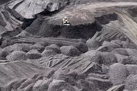 An aerial photo shows heavy vehicles and machinery being operated to collect coal along the coast of Peunaga Cut Ujong, Meureubo district, Aceh, on January 9, 2026. (Photo: Antara)