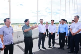 Prime Minister Pham Minh Chinh inspects Nguyen Hoang bridge, July 26, 2025. (Photo: VNA)