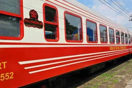 The luxury train, adorned in the signature red of the flamboyant flower, Hai Phong’s iconic bloom, is set to operate on the Hanoi–Hai Phong route. (Photo: VietnamPlus)