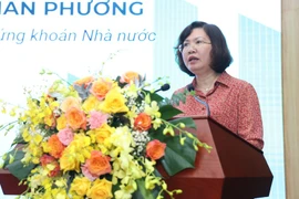 Vu Thi Chan Phuong, Chairwoman of the State Securities Commission, delivers a speech at the seminar. (Photo: VietnamPlus)