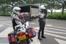  Singapore Traffic Police officers conducting enforcement against speeding on an expressway. (Photo: Singapore Police Force)