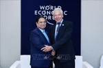 Prime Minister Pham Minh Chinh meets with WEF Interim Chairman Peter Brabeck-Letmathe. (Photo: VNA)